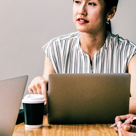 closeup of woman sitting at conference table