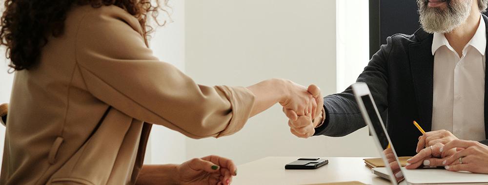 handshake between man and woman