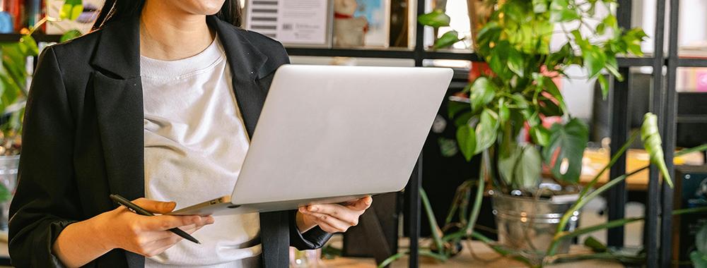 woman holding laptop