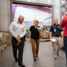 UC Davis employees walk through mail services facitility