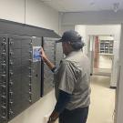 Physical Plant Mechanic Luis “Bobby” Gallardo uses the touchscreen interface of an electronic smart key cabinet system installed at UC Davis Facilities Management.