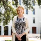 Vice Chancellor Clare Shinnerl standing in front of Mrak Hall