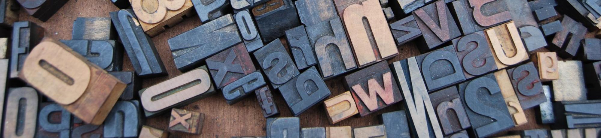 typography - pile of metal type from letterpress